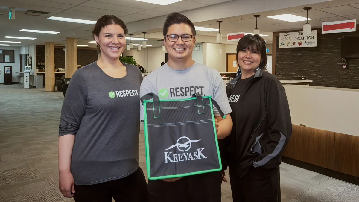Front desk staff smiling at Keeyask camp