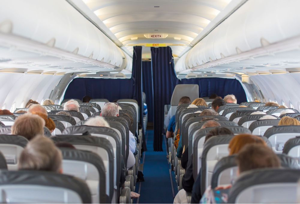 people-seated-rows-commercial-plane